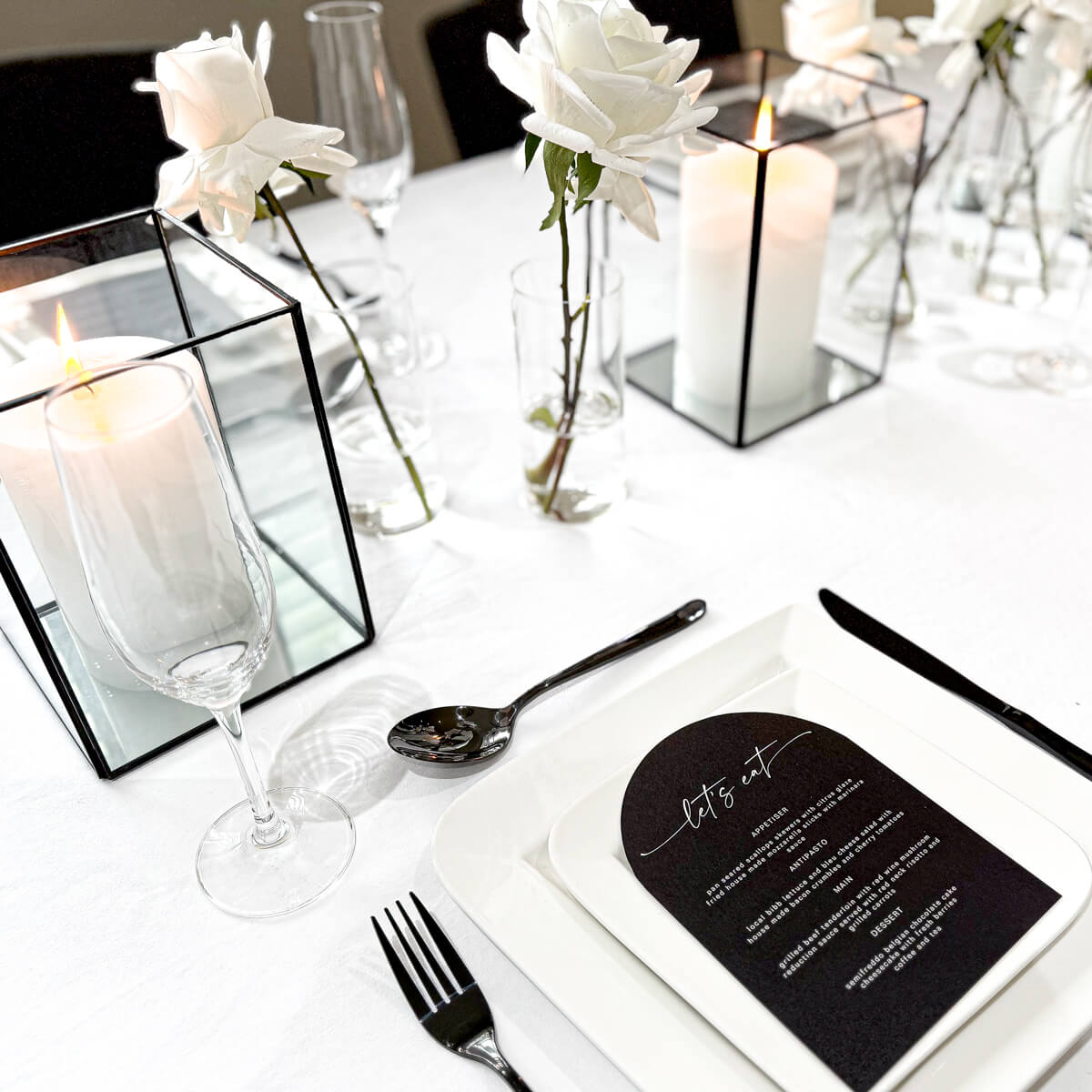 detail shot of black and white table styling set up with candles