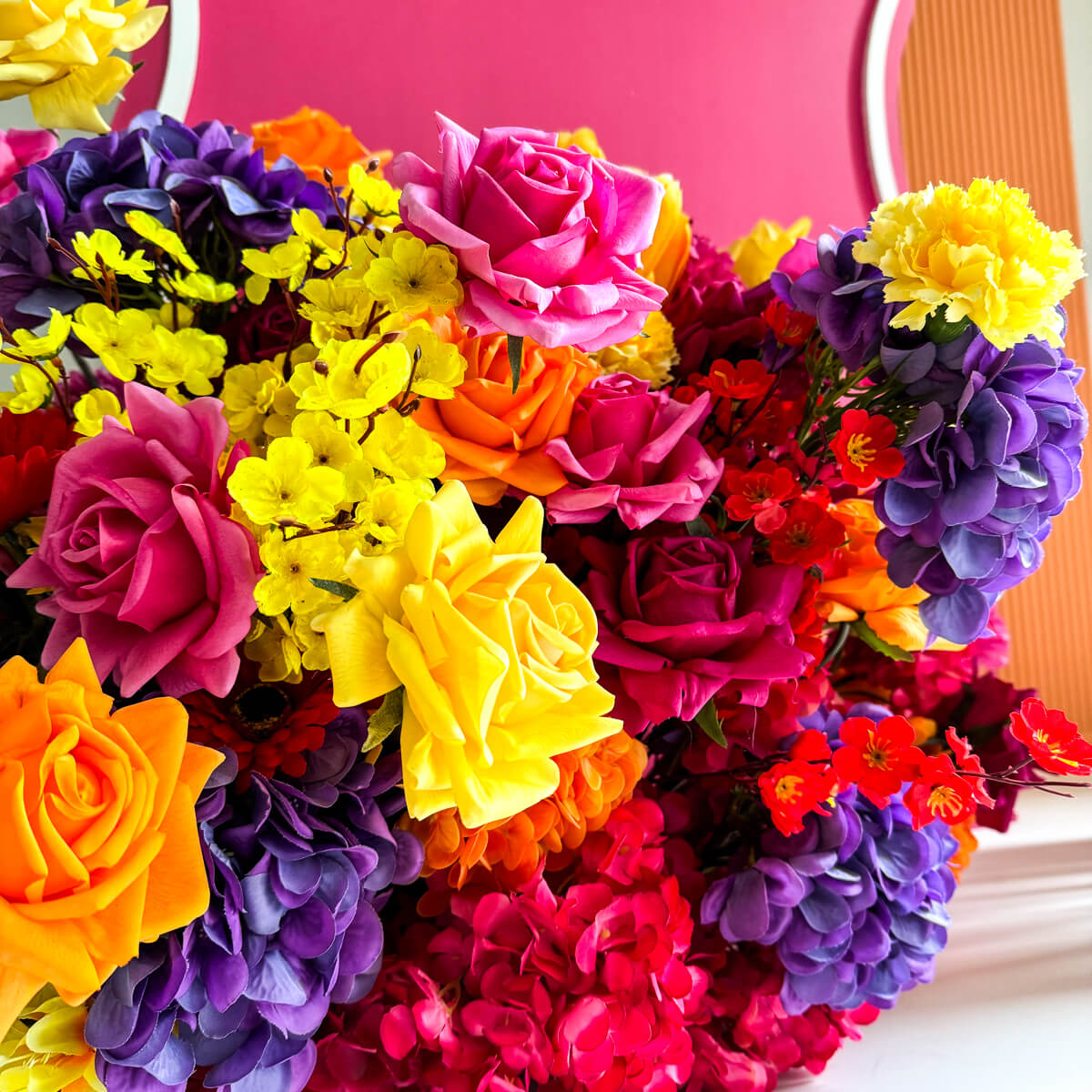 close up of vibrant coloured roses, hydrangeas and carnations