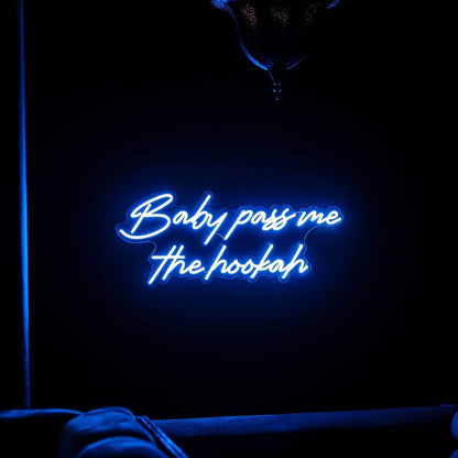 blue baby pass me the hookah neon sign hanging above couch