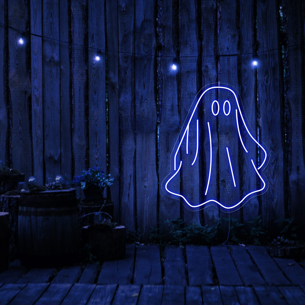blue draped ghost neon sign hanging on timber wall