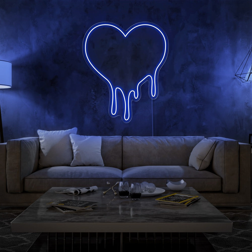 blue melting heart neon sign hanging on living room wall