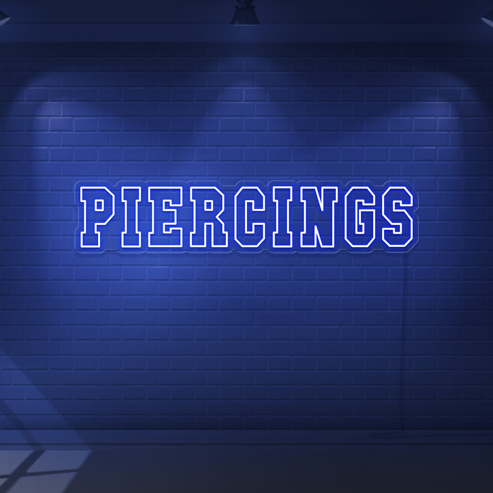 blue piercings neon sign hanging on wall