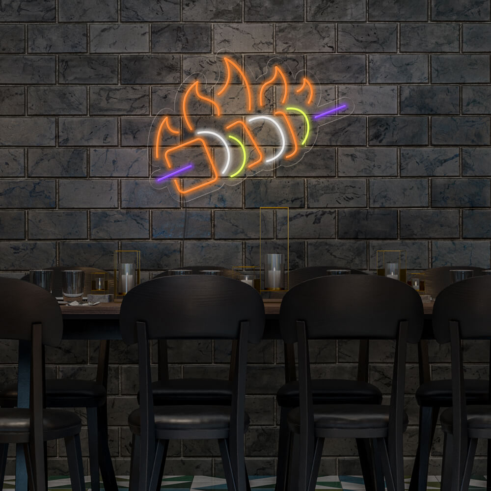 chicken skewer neon sign hanging above table on wall