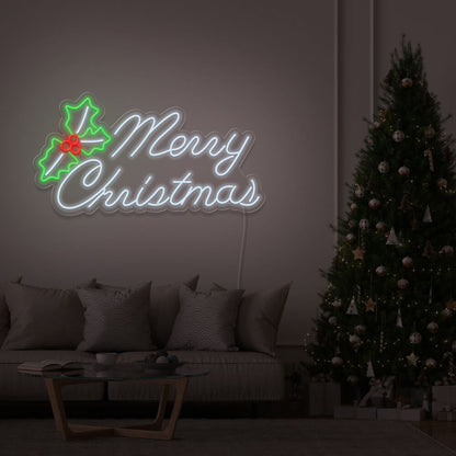 cold white merry chirstmas mistletoe neon sign hanging above couch next to christmas tree