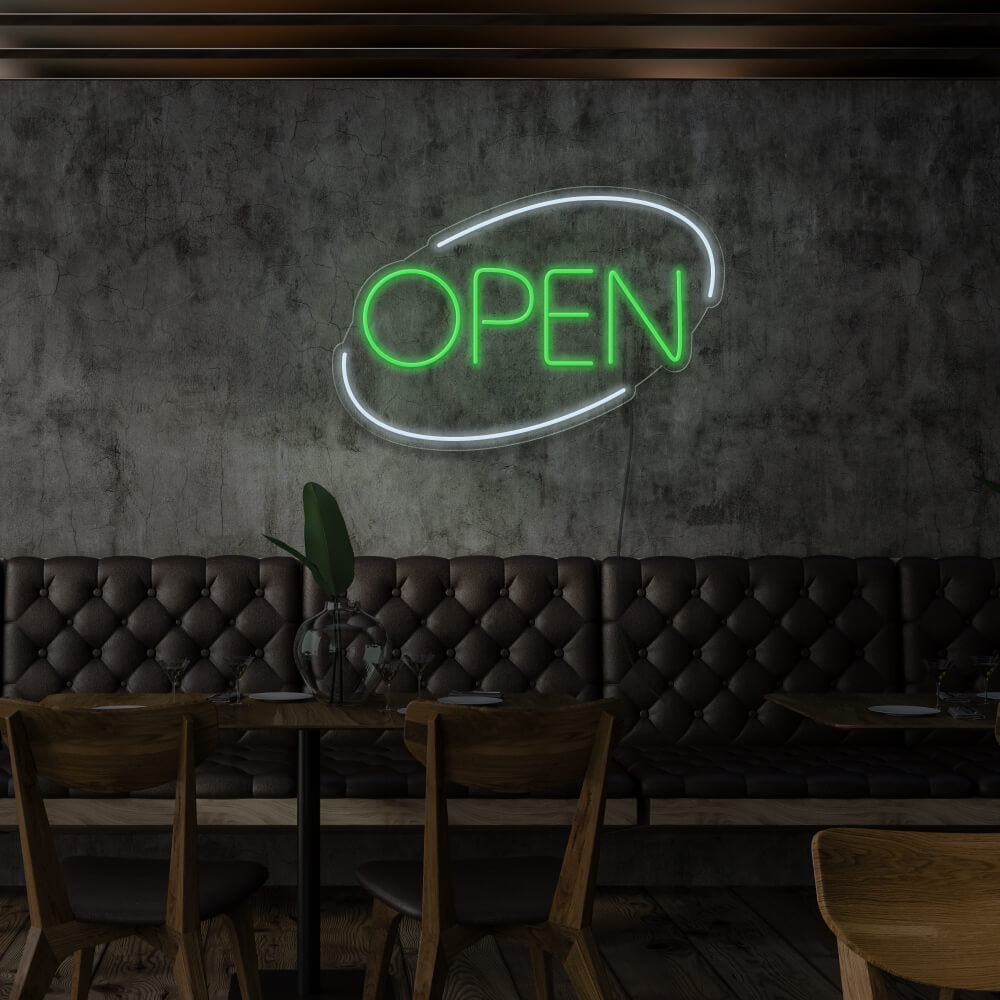 green open neon sign hanging on restaurant wall