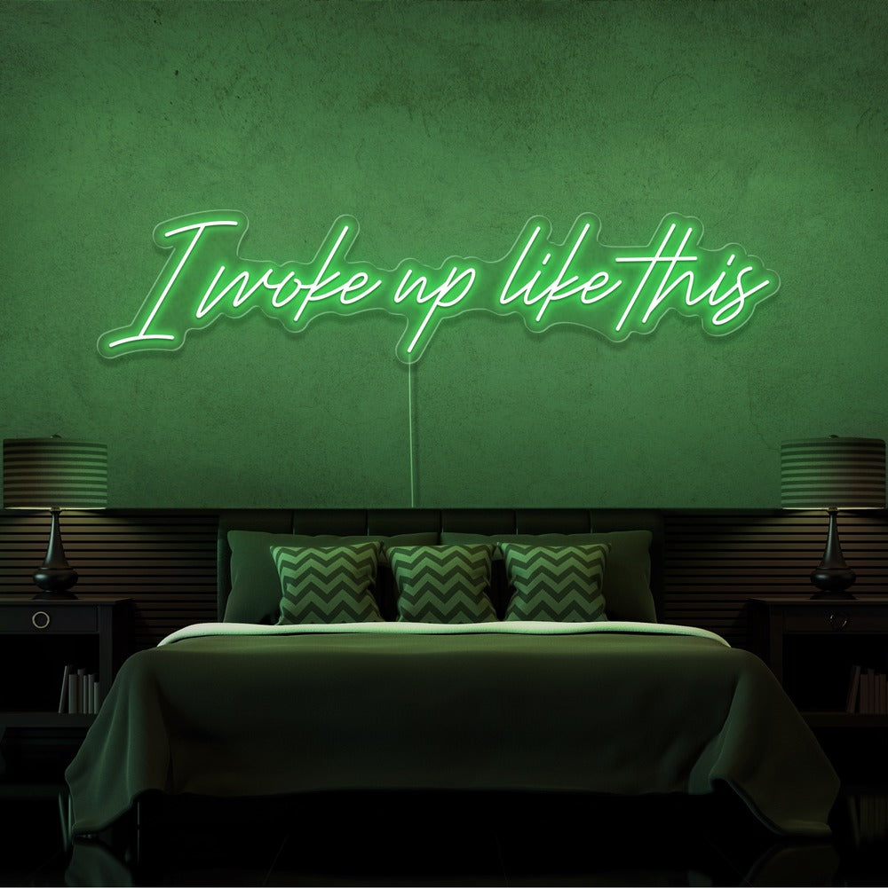 green i woke up like this neon sign hanging on bedroom wall