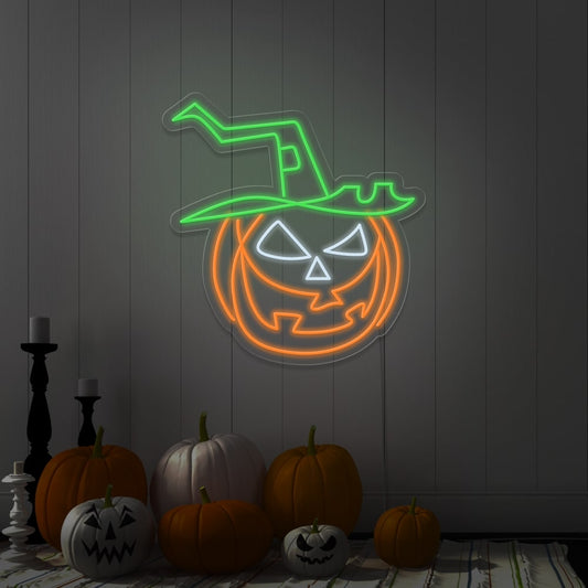 green pumpkin hat neon sign hanging on wall next to pumpkins