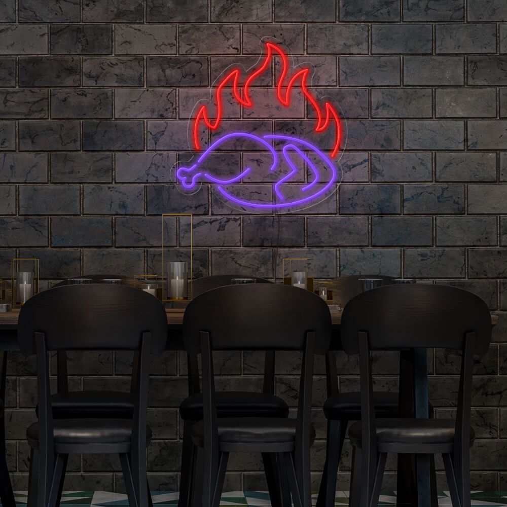 purple hot chicken neon sign hanging on restaurant wall