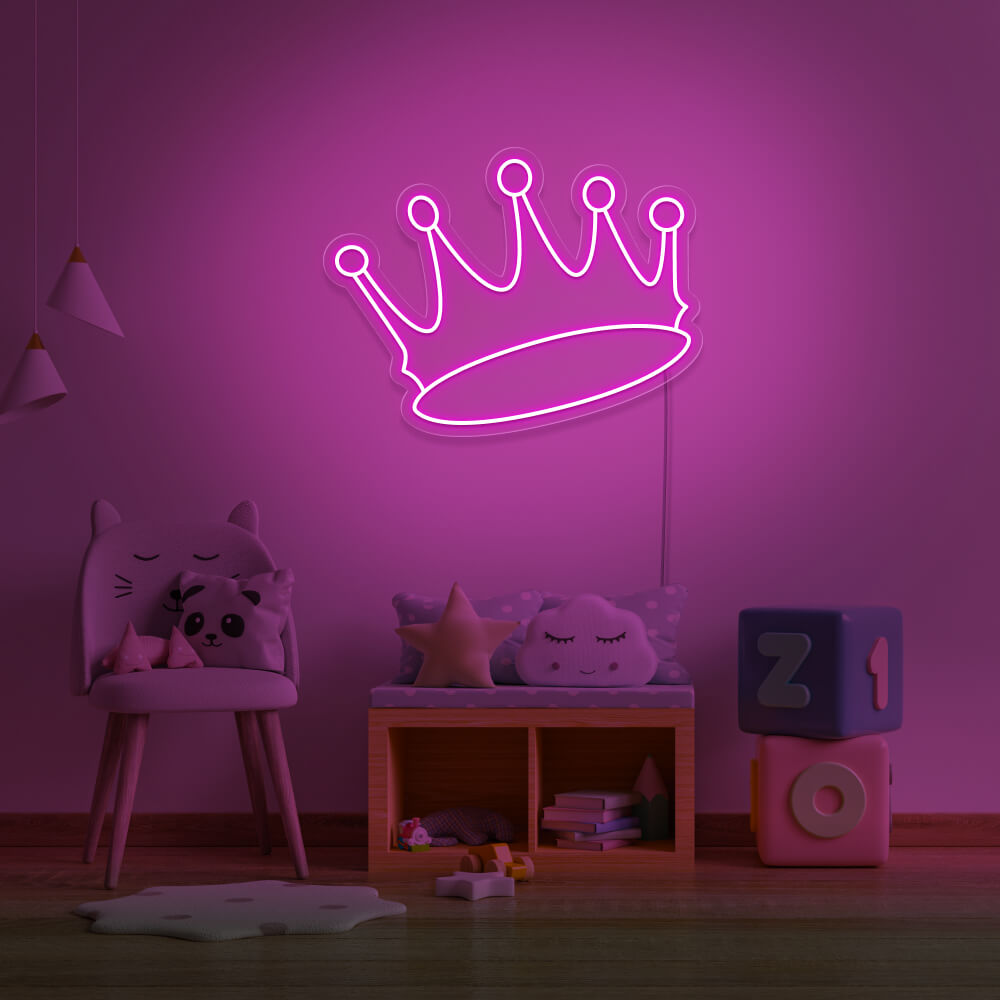 hot pink crown neon sign hanging on kids bedroom wall