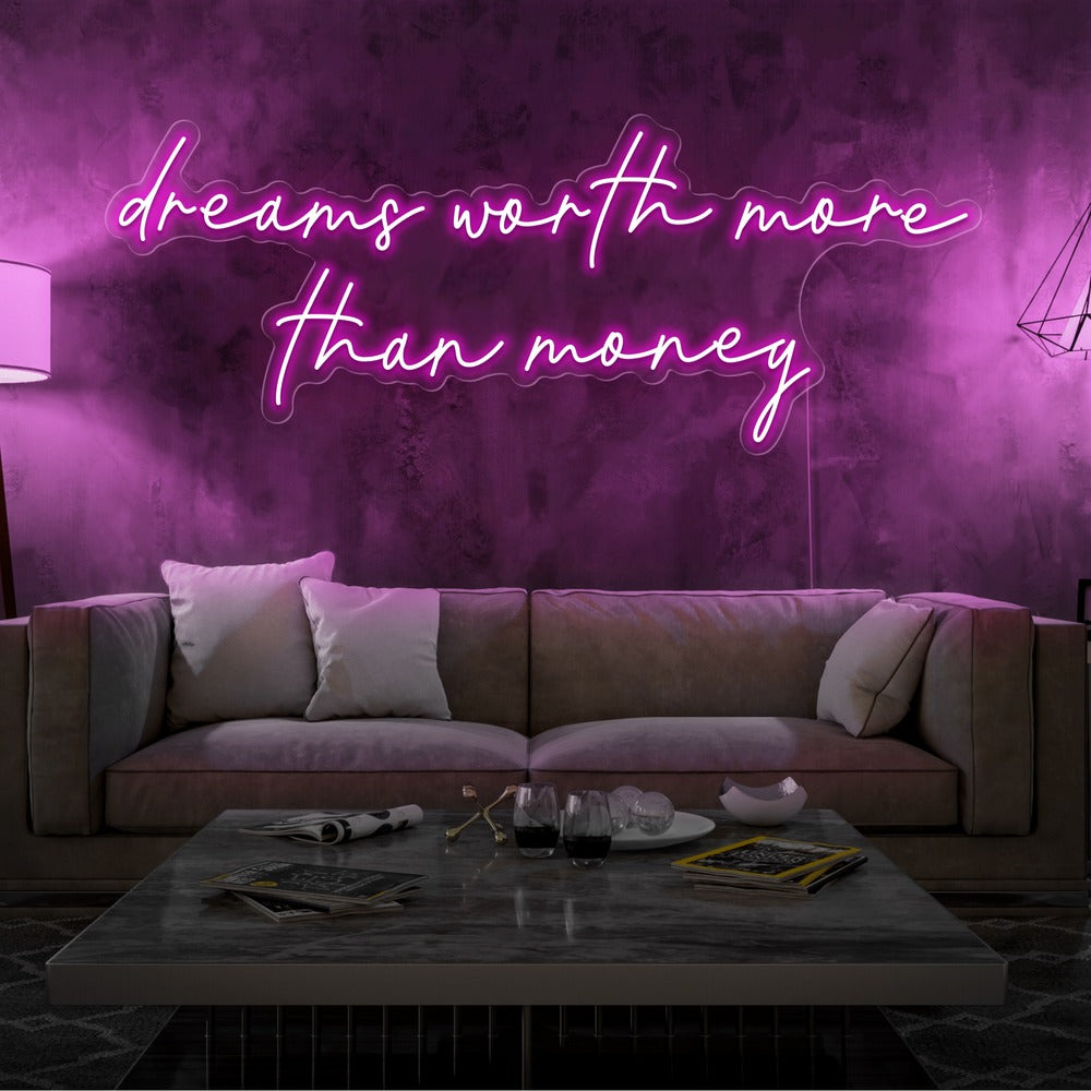 hot pink dreams worth more than money neon sign hanging on living  room wall