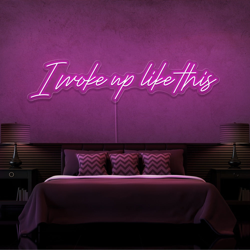 hot pink i woke up like this neon sign hanging on bedroom wall