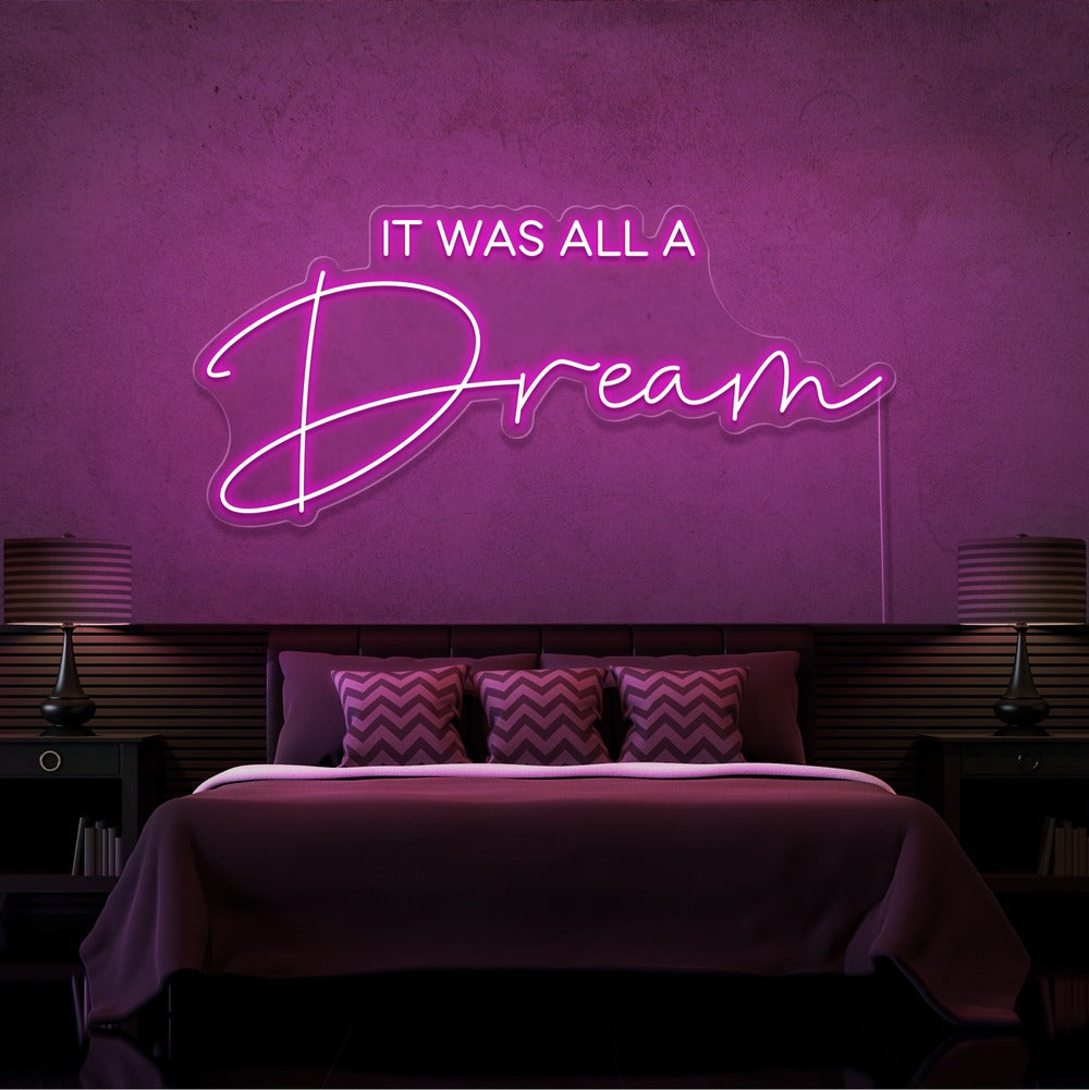 hot pink it was all a dream neon sign hanging on bedroom wall