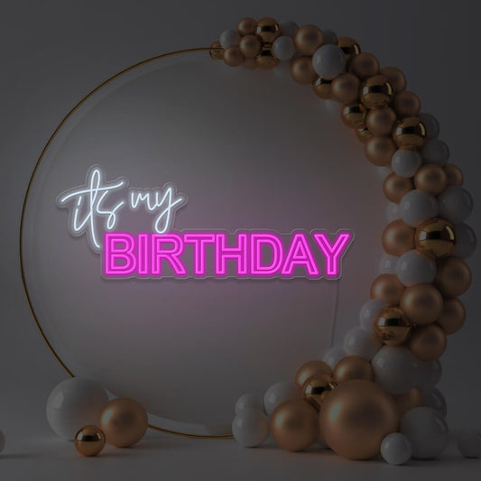 hot pink it's my birthday neon sign hanging in gold hoop backdrop with balloons