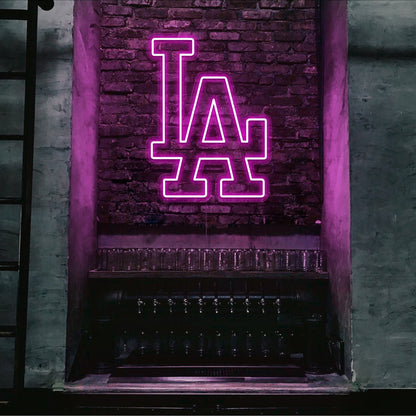 hot pink LA neon sign hanging on bar wall