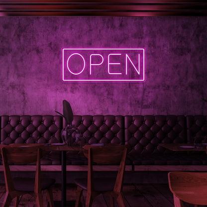hot pink open neon sign hanging on cafe wall