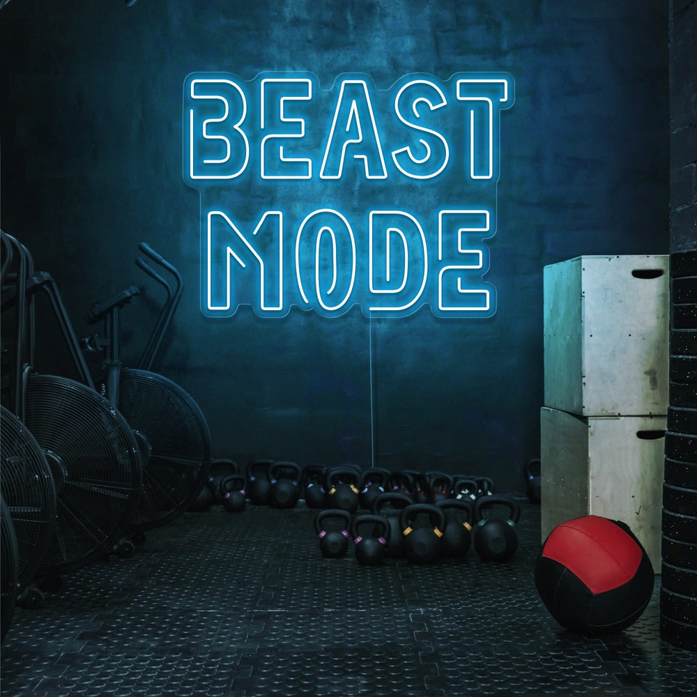 ice blue beast mode neon sign hanging on gym wall