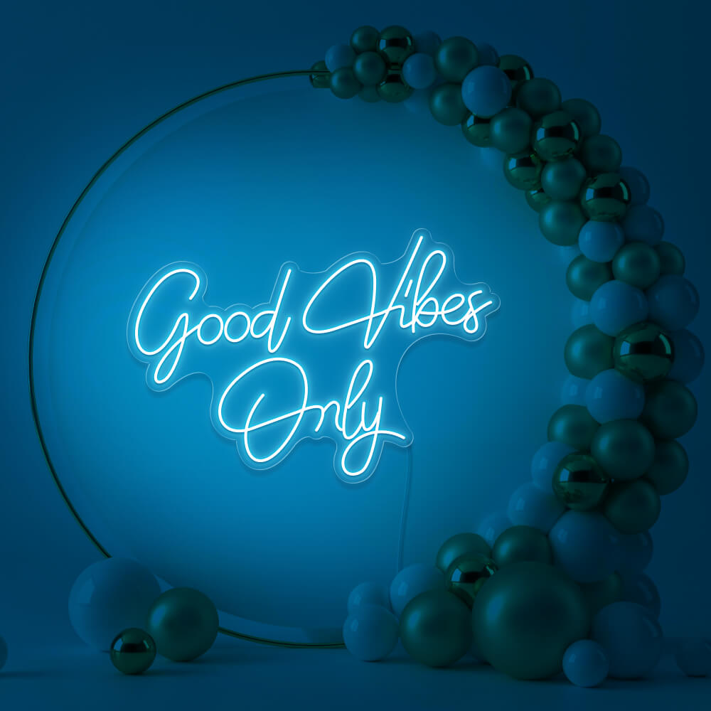 ice blue good vibes only neon sign hanging inside balloon hoop backdrop