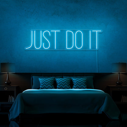 ice blue just do it neon sign hanging on bedroom wall