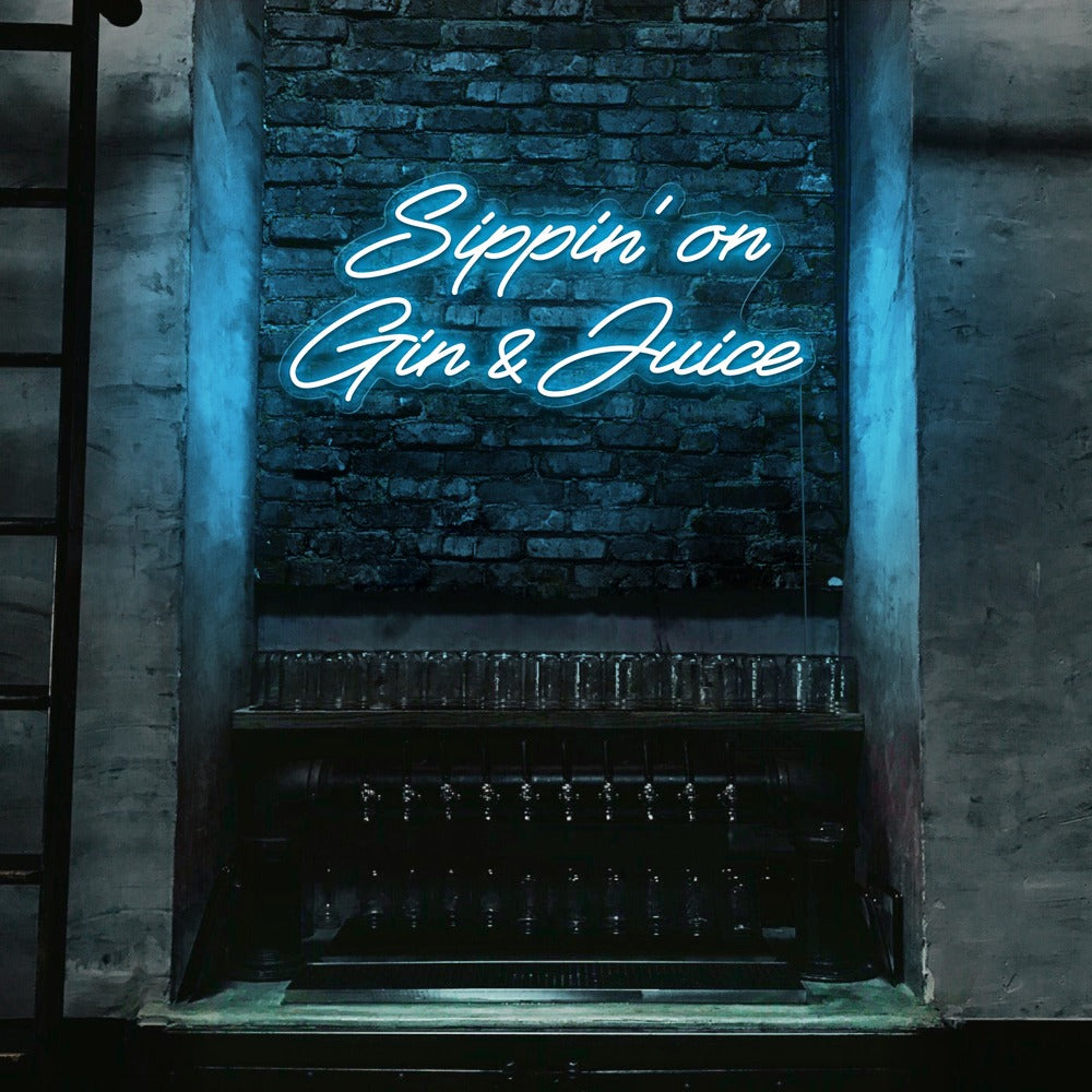 ice blue  sippin on gin and juice neon sign hanging on bar wall