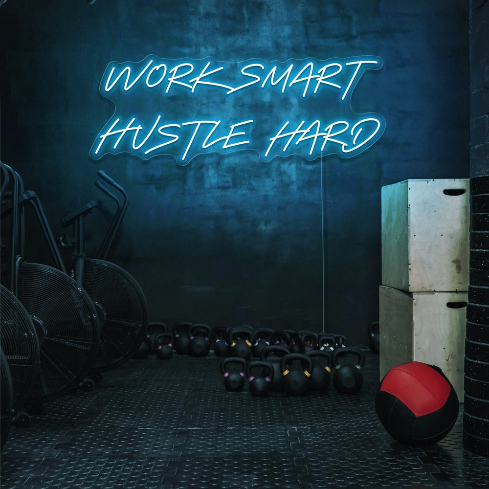 ice blue work smart hustle hard neon sign hanging on gym wall