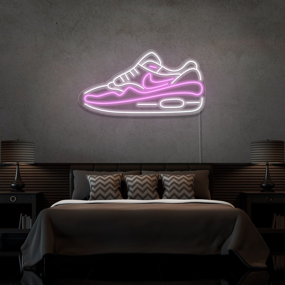 light pink air max 1 sneaker neon sign hanging on bedroom wall