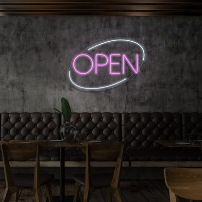 light pink open neon sign hanging on restaurant wall