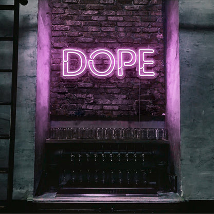 light pink dope neon sign hanging on bedroom wall