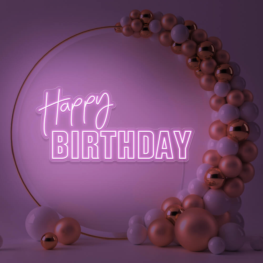 light pink happy birthday neon sign hanging inside gold hoop balloon backdrop