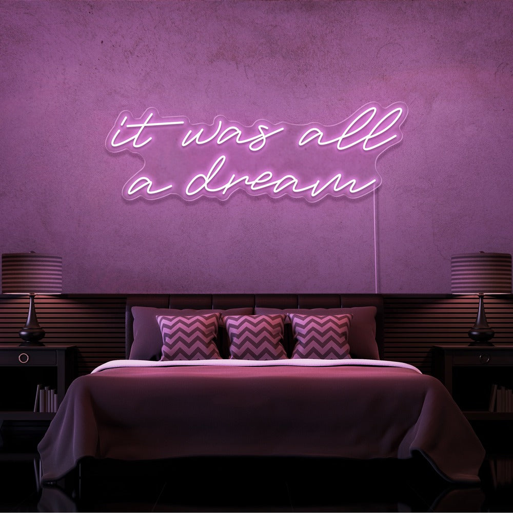 light pink it was all a dream neon sign hanging on bedroom wall