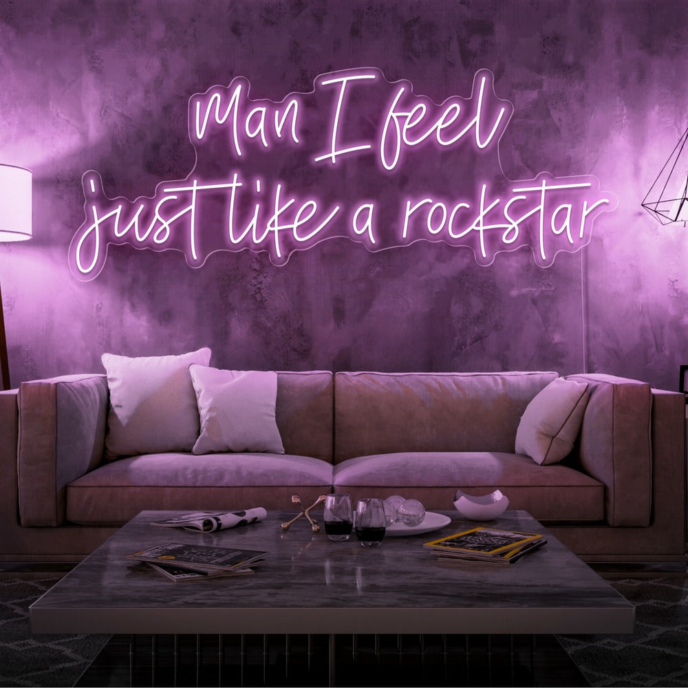 light pink man i feel just like a rockstar neon sign hanging on living room wall