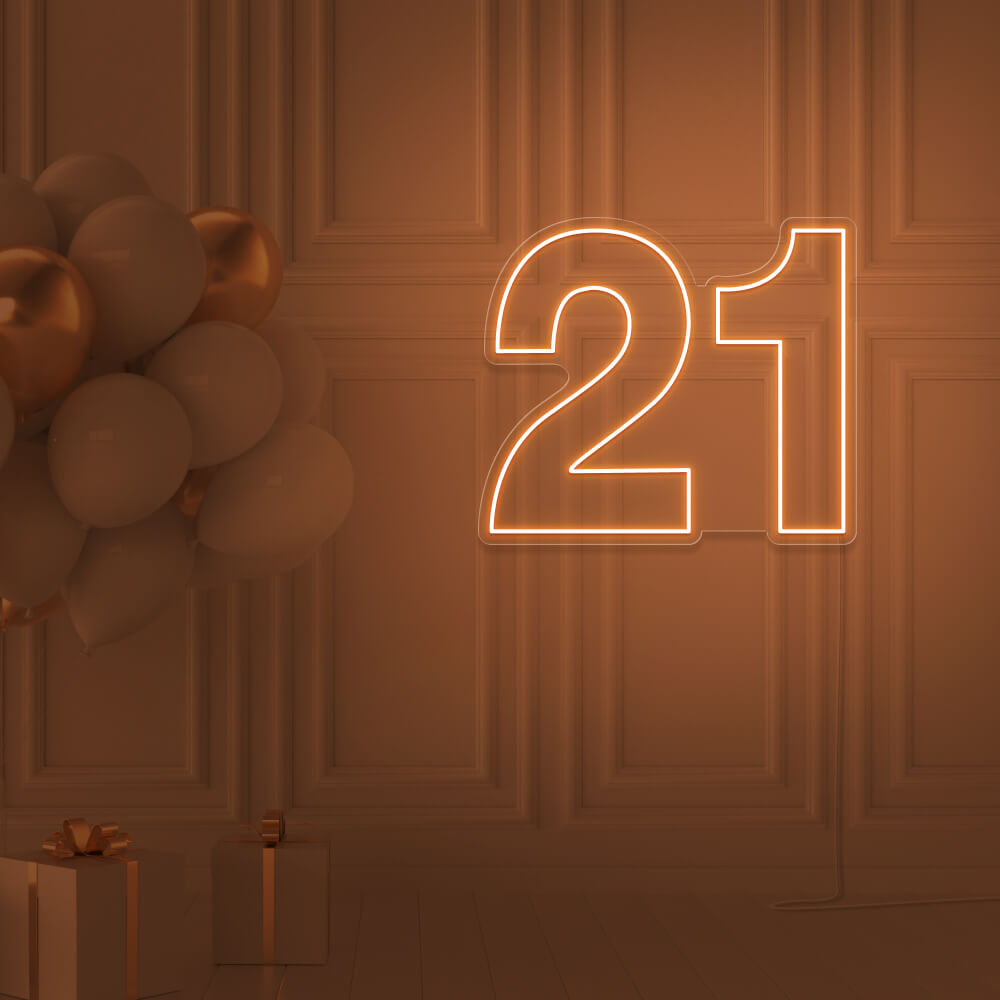 orange  21 neon sign hanging on wall with balloons