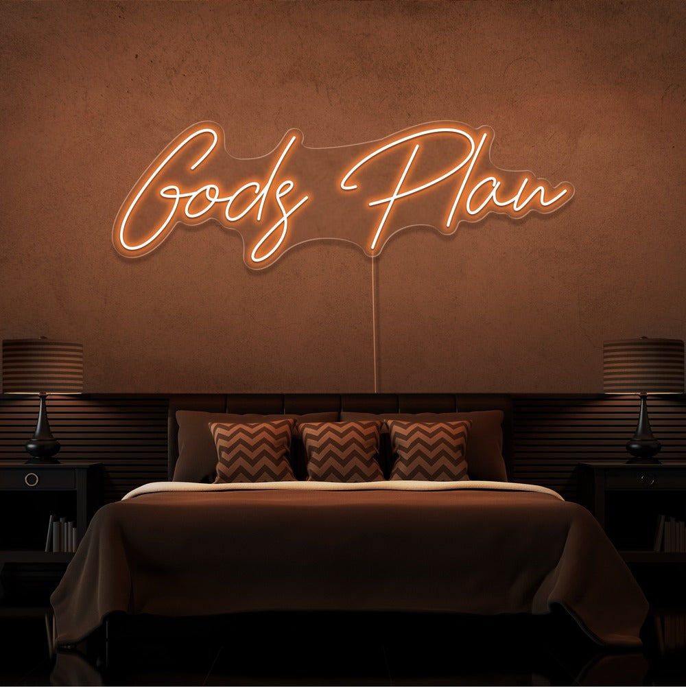 orange gods plan neon sign hanging on bedroom wall