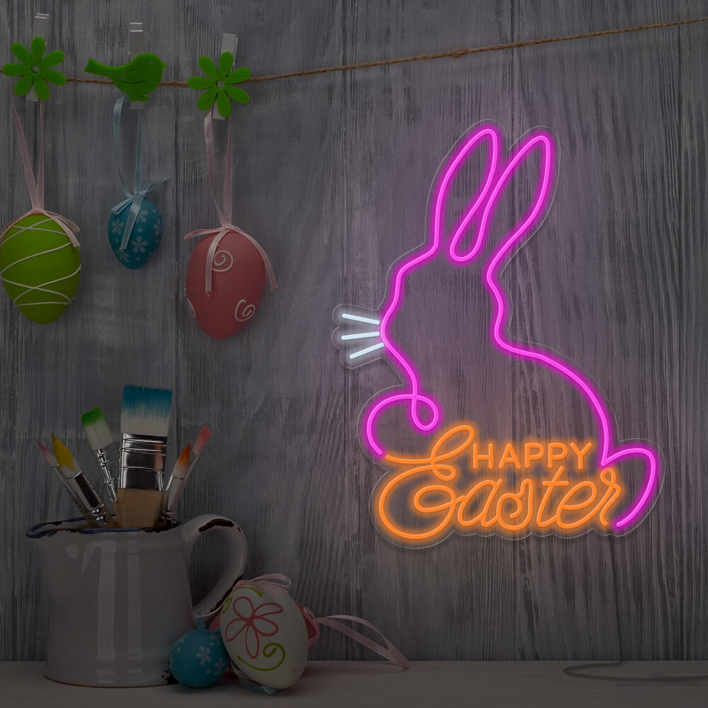 orange happy easter bunny neon sign hanging on wall