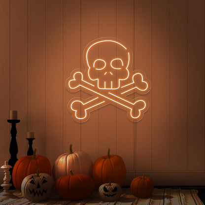 orange skull bones neon sign with pumpkins on floor