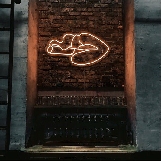 orange smoking lips neon sign hanging on bar wall