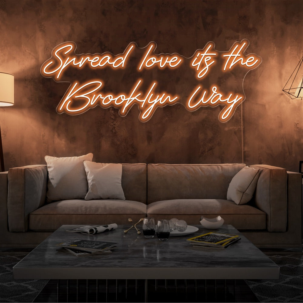 orange spread love the brooklyn way neon sign hanging on living room wall