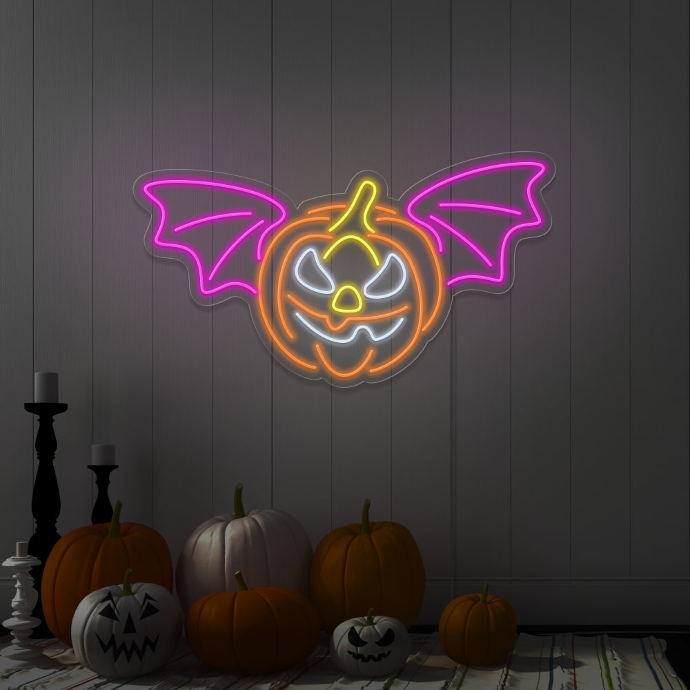 pink flying pumpkin neon sign hanging on wall above pumpkins