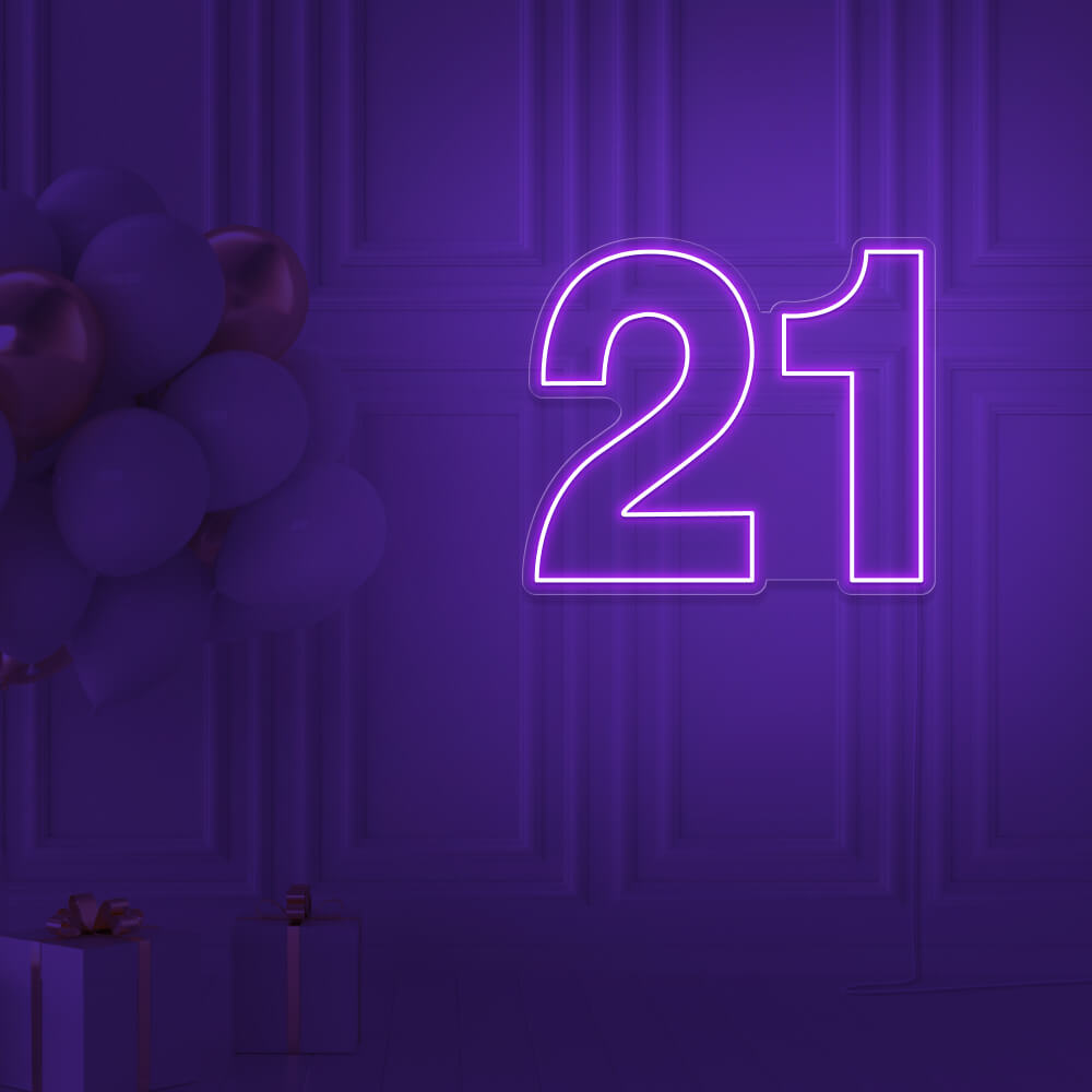 purple  21 neon sign hanging on wall with balloons