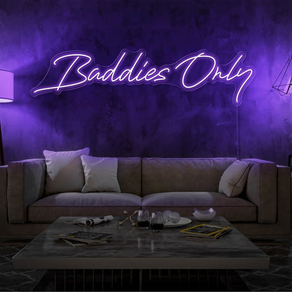 purple baddies only neon sign hanging on living room wall