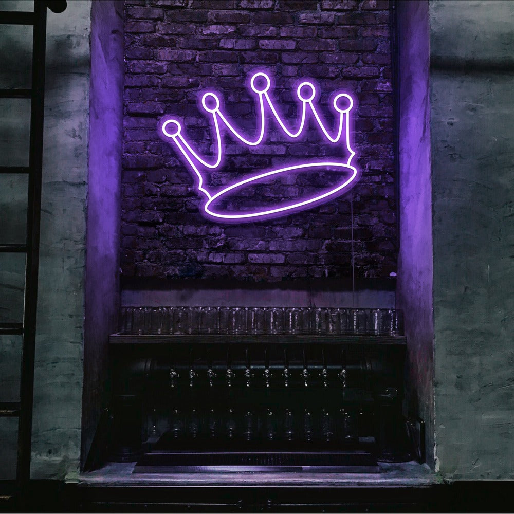 purple crown neon sign hanging on bar wall