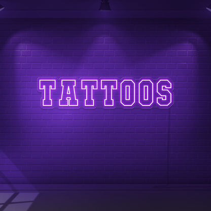 purple tattoos neon sign hanging on wall