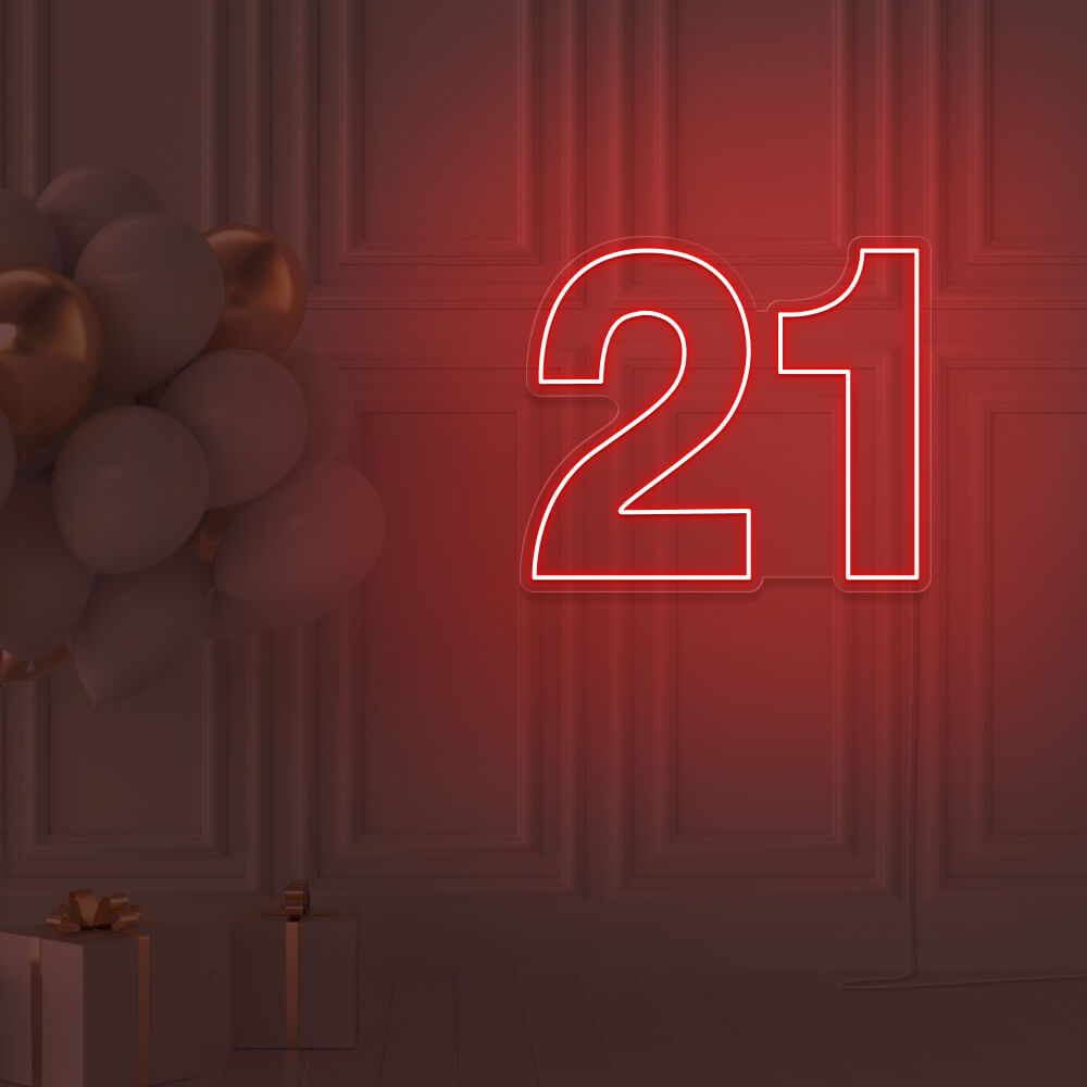 red  21 neon sign hanging on wall with balloons