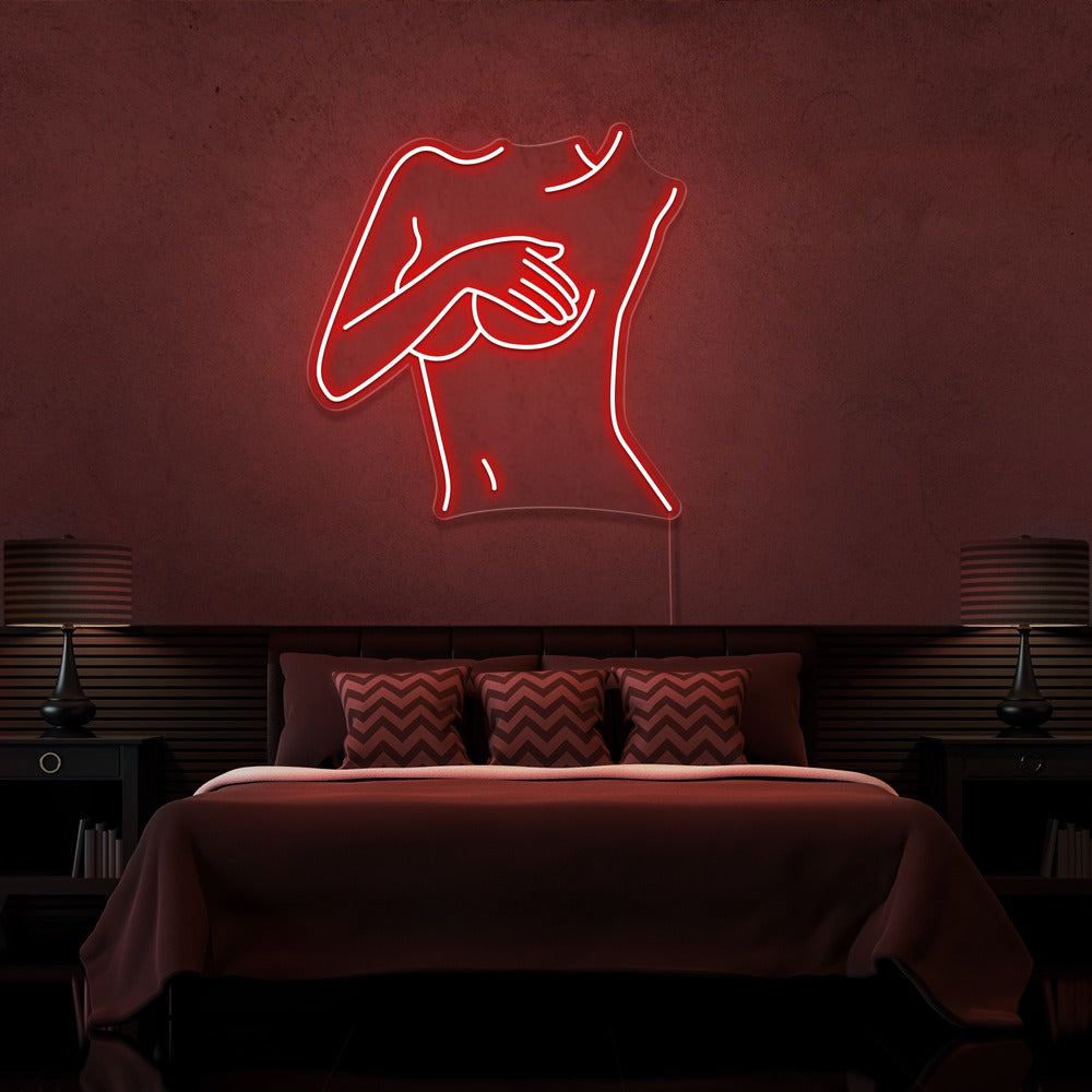 red cover up neon sign hanging on bedroom wall