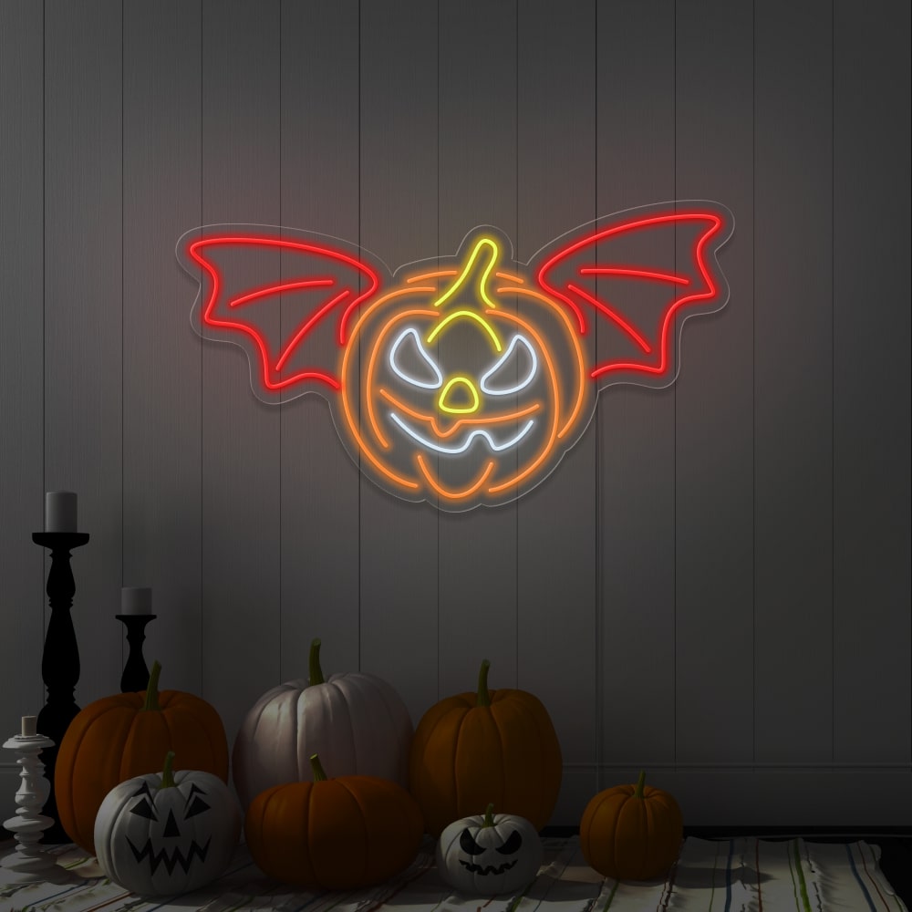red flying pumpkin neon sign hanging on wall above pumpkins