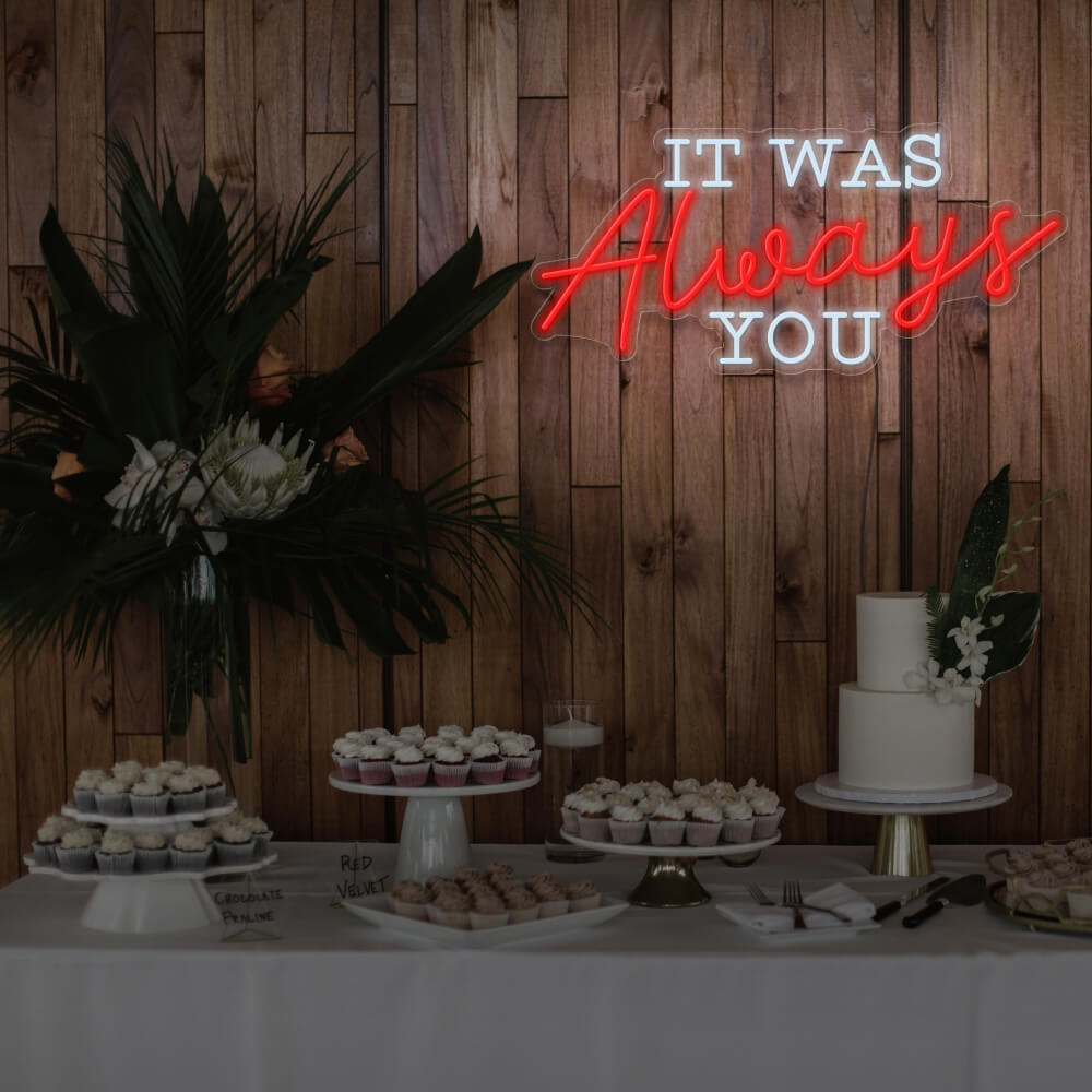 red it was always you neon sign hanging above dessert table