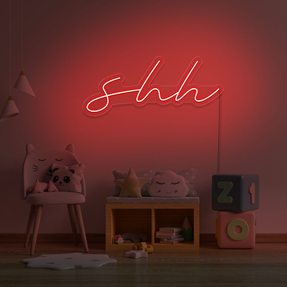 red shh neon sign hanging on kids bedroom wall