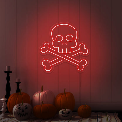 red skull bones neon sign with pumpkins on floor