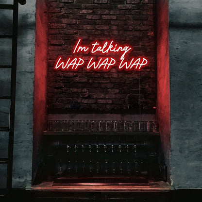 red im talking wap wap wap neon sign hanging on bar wall