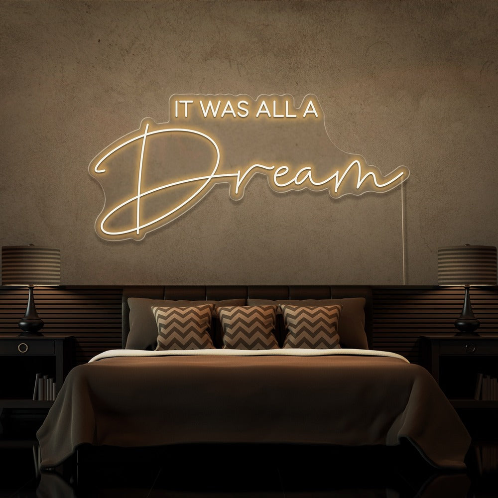 warm white it was all a dream neon sign hanging on bedroom wall