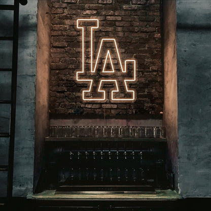 warm white LA neon sign hanging on bar wall